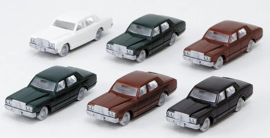 Set of six N scale 1980s Toyota model vehicles by Kato USA Inc. featuring detailed miniature car replicas in the collection.