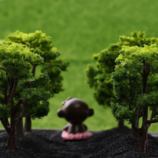 WINOMO 12-piece miniature model trees for train railroad scenery and landscape enhancement, showing detailed small trees for model layouts.