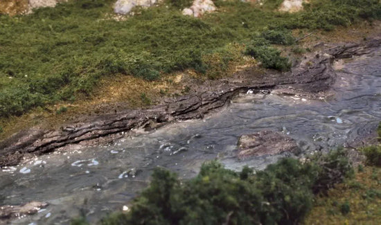 Woodland Scenics C1245 rock mold for creek bank modeling, showing detailed textured mold used for realistic terrain creation.
