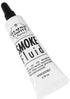 Close-up of Broadway Limited Imports smoke fluid bottle for model train tracks, showing the 0.25oz cleaner and lubricant container