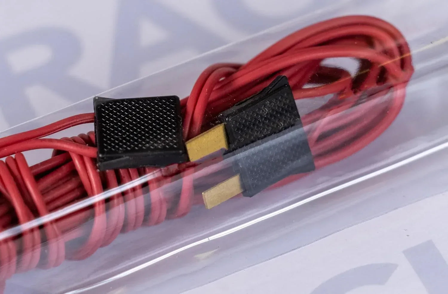 Red Bachmann Trains E-Z Track 10-foot power extension wire for model train layouts, designed for easy electrical connectivity.
