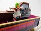 Oompa Loompa Gondola toy from Willy Wonka & the Chocolate Factory model, featuring colorful Oompa Loompa figures and a gondola design.