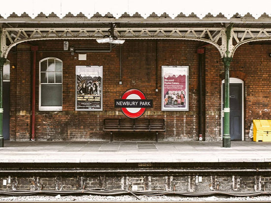 Vintage train station backdrop with old brick wall and nostalgic railway platform, perfect for portrait photography and studio props.