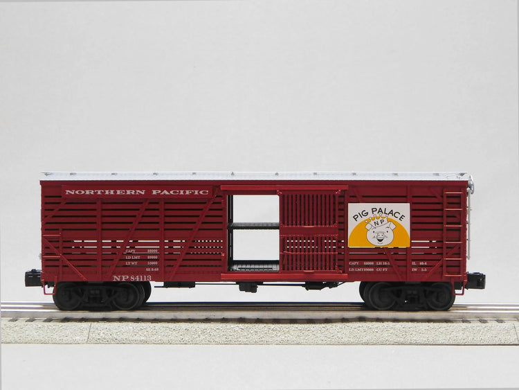 Three VISIONLINE Northern Pacific stock cars in O gauge model 2226900, featuring detailed paint and realistic design.