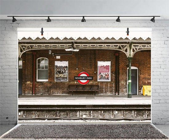 Vintage train station backdrop with old brick wall and railway platform, ideal for portrait photography and studio props.