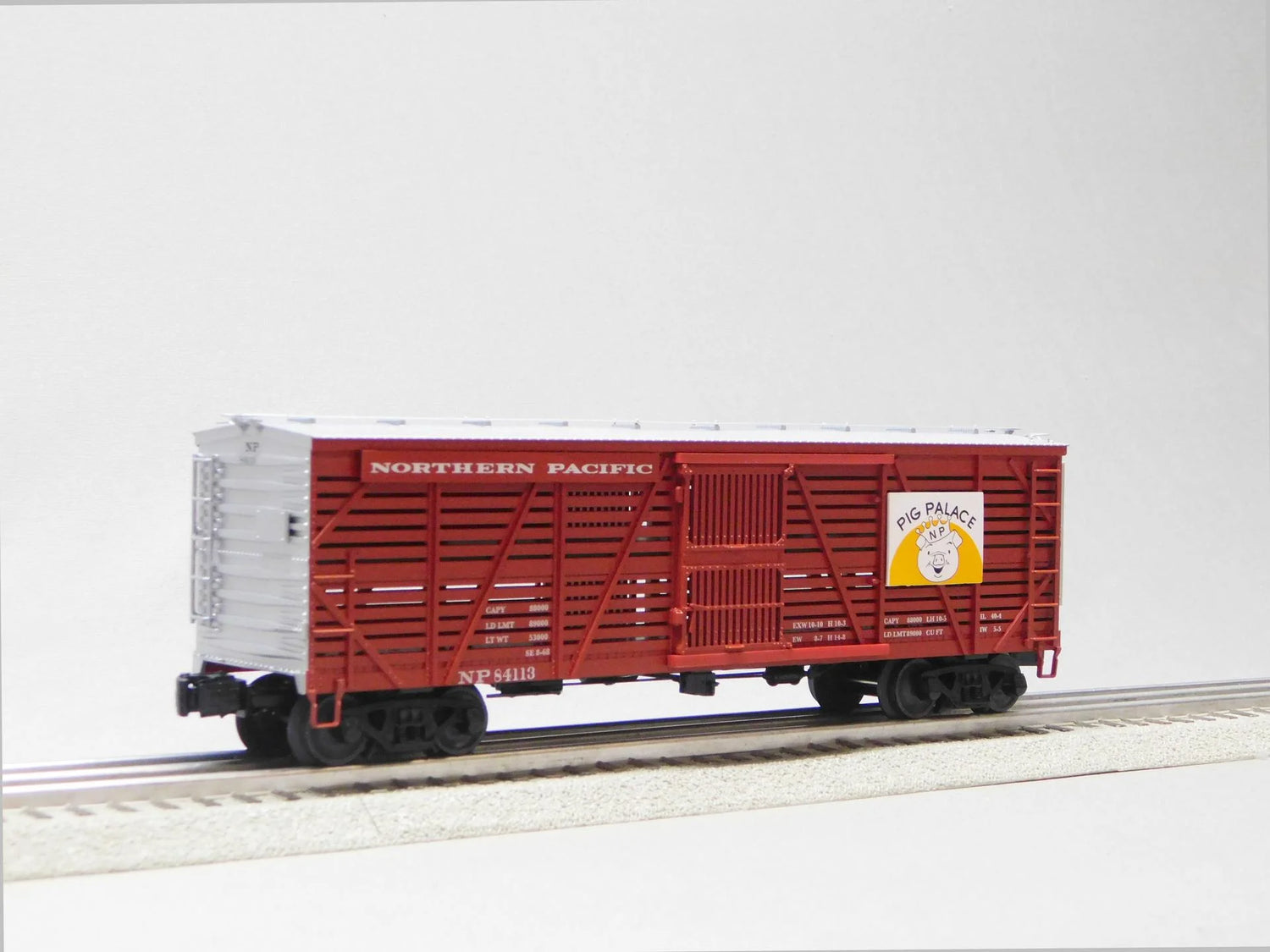 Northern Pacific stock cars from the VISIONLINE O gauge model 3-pack by BYMRR Train Store, featuring detailed train car models.