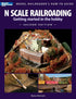 Open book titled "N Scale Railroading," showing detailed diagrams and beginner tips for starting in N scale model train hobby.