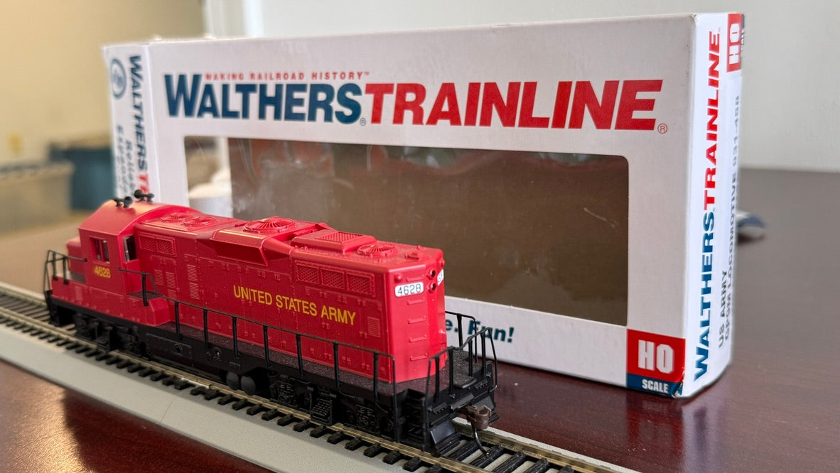 Pre-owned Walthers HO US Army GP9M locomotive by BYMRR Train Store, detailed model with military paint scheme and realistic features.