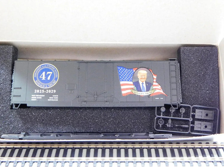 HO scale Micro-Trains boxcar kit featuring Donald Trump 2025 Presidential Edition, detailed model in HO train collectible series.