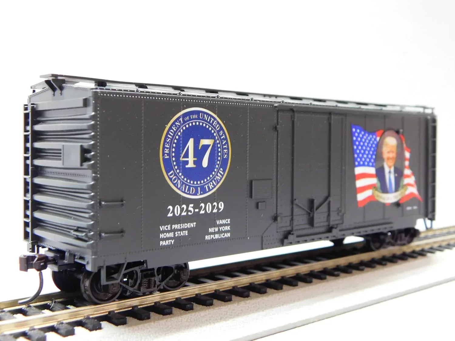 HO scale Micro-Trains boxcar kit featuring Donald Trump 2025 Presidential Edition, detailed model in blue with white and red markings.