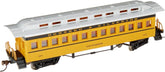 Bachmann yellow passenger car for model railroads, detailed prototype design, sits on tracks with windows and realistic features
