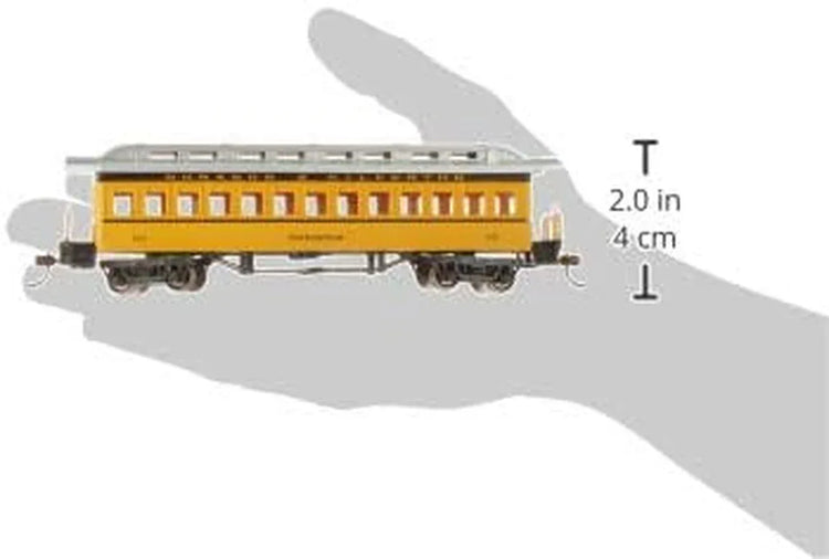 Bachmann yellow passenger car for model railroads, detailed plastic train car with windows and realistic design.