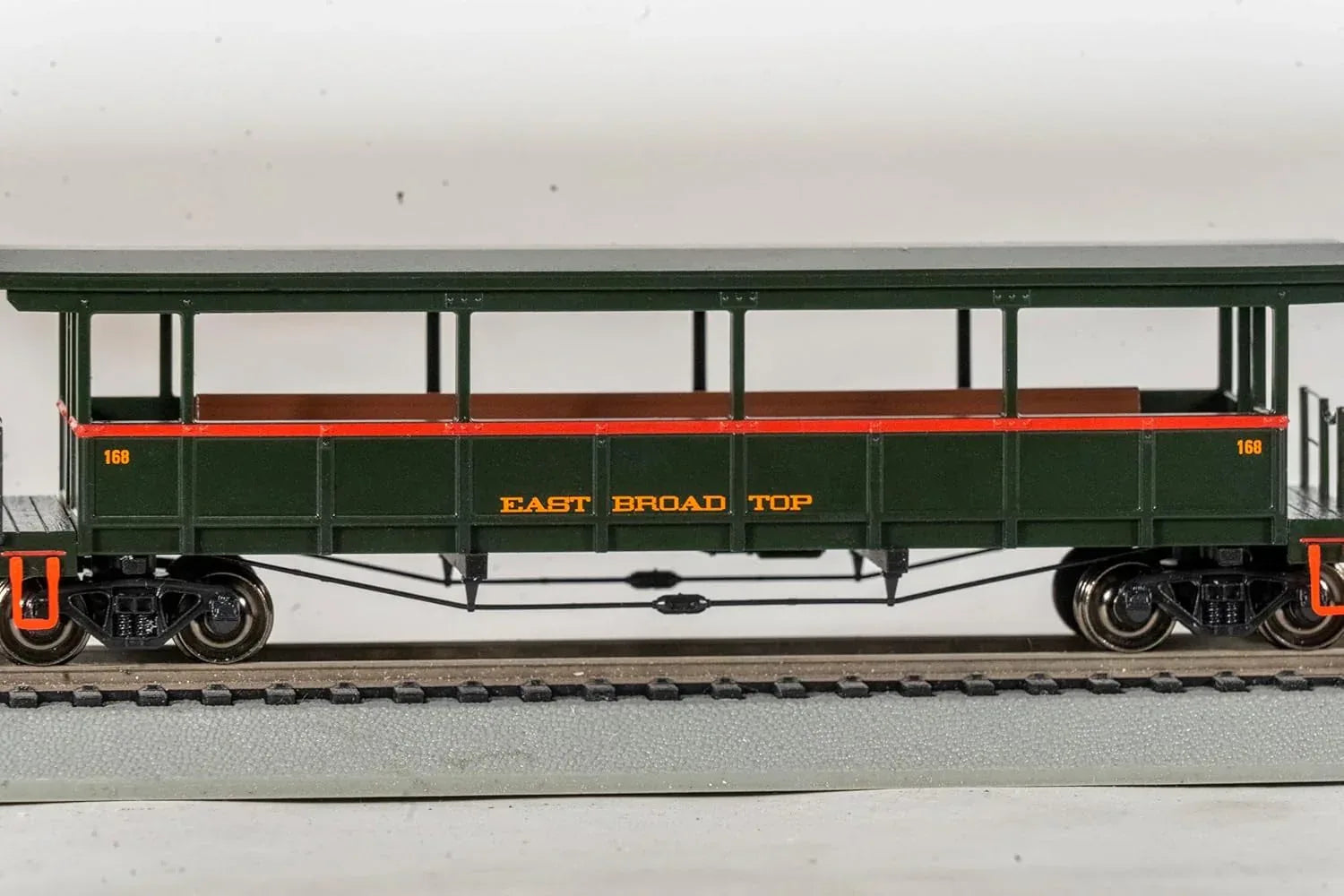 HO scale Bachmann East Broad Top open-sided excursion train car with detailed interior and vintage design.