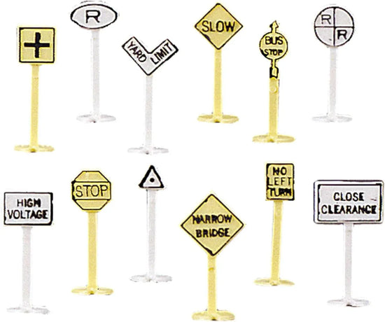 Set of 24 Bachmann N scale railroad and street signs scenery accessories for model train layouts.