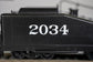 Bachmann HO scale ATSF USRA 0-6-0 locomotive with smoke and slope tender on model train track