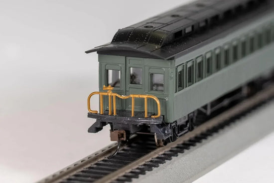 Unlettered green Bachmann HO scale passenger train coaches for model train collectors, circa 1860-1880.