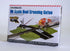 HO scale Bachmann Trains E-Z Track crossing gate, medium size, with rail tracks and safety barrier on model train layout.