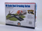HO scale Bachmann Trains E-Z Track crossing gate, medium size, with detailed rail and gate components visible.