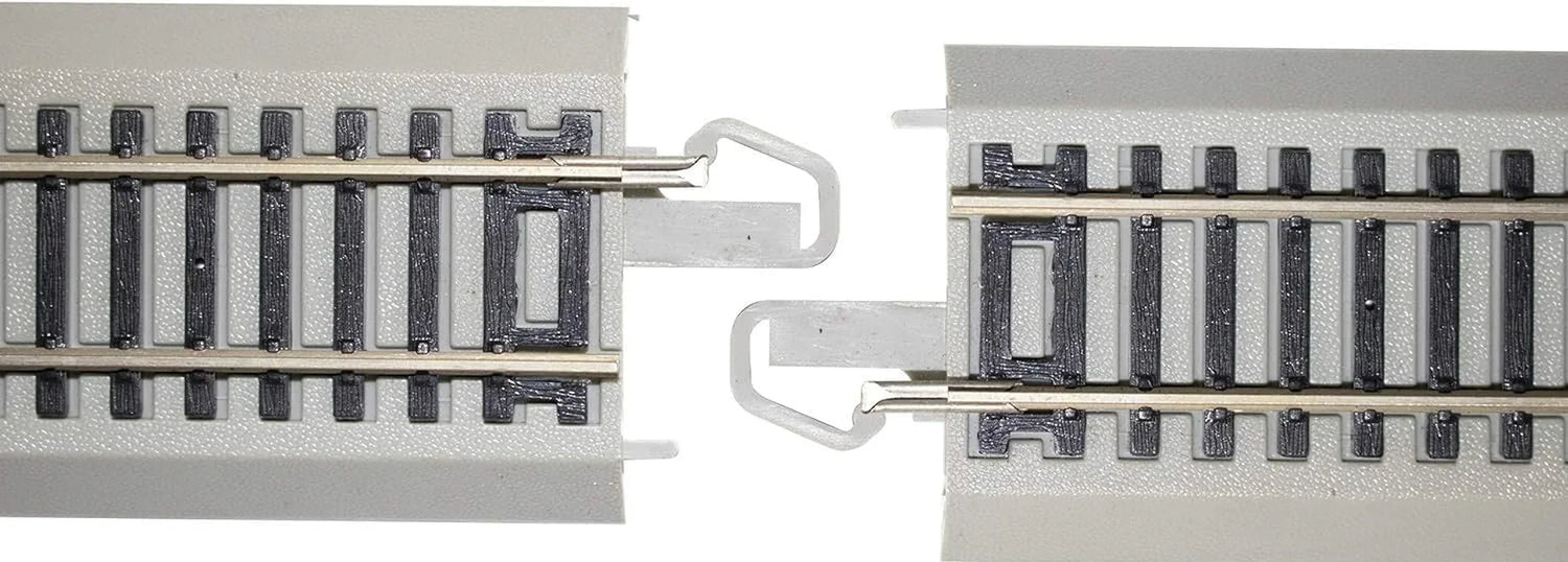 Set of four Bachmann Trains HO scale snap-fit E-Z Track 3-inch straight sections with nickel silver rails and gray roadbed.