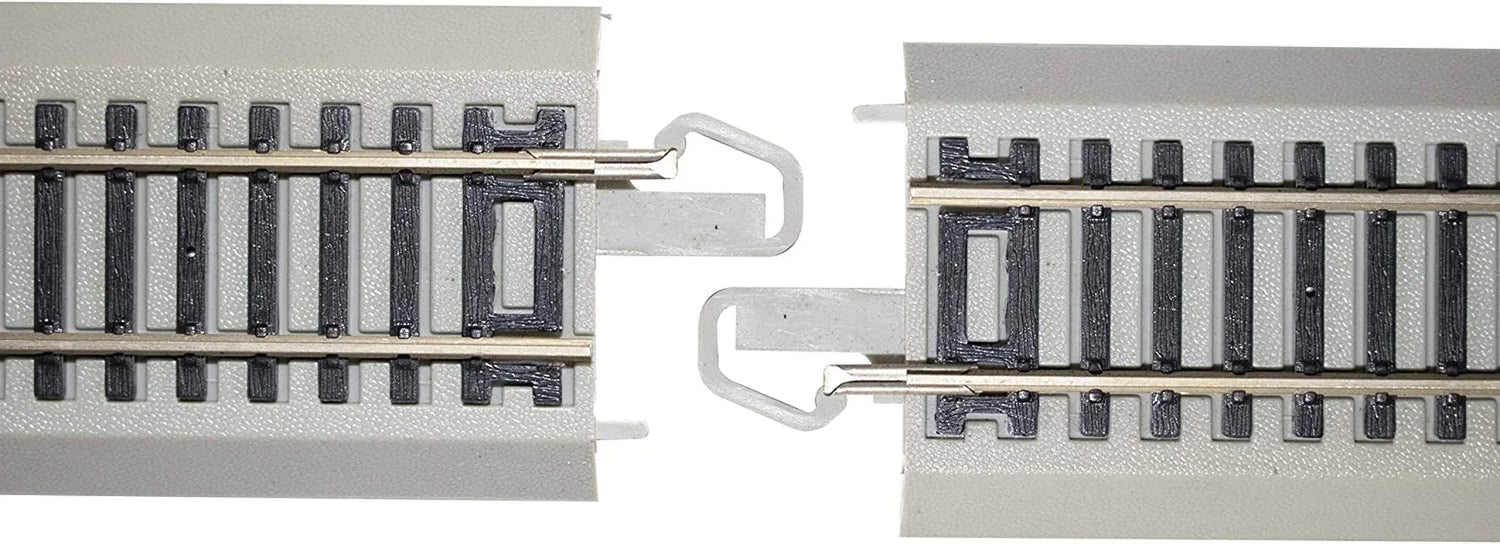 HO scale Bachmann Trains EZ Track expansion set with nickel silver rails and grey roadbed, medium size layout.