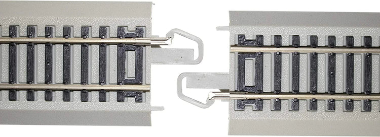 HO scale Bachmann Trains EZ Track expansion set with nickel silver rails and grey roadbed, medium size layout.
