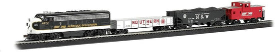 Bachmann Trains Thoroughbred HO Scale electric train set with locomotive and cars on a model railway track.