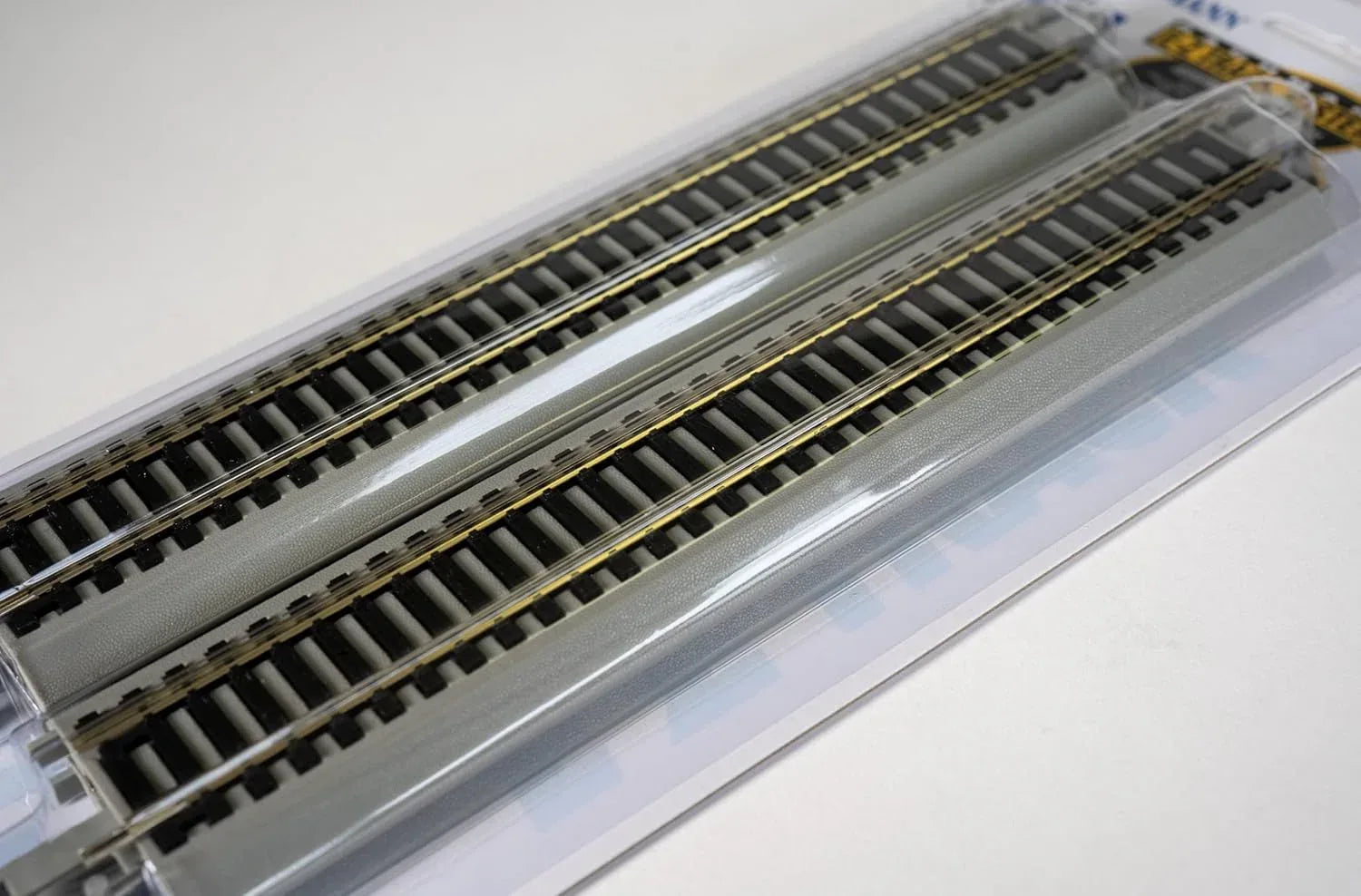Bachmann Trains HO scale E-Z Track 9-inch straight track pack with nickel silver rails and gray roadbed, four-piece set.