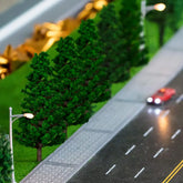 N scale model pine tree set by BLLREMIPSUR with 16 assorted sizes for scenic landscapes, ranging from 1.4 to 6.3 inches tall.