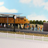 Painted HO scale passenger figures by Evemodel showing seated and standing passengers for 1:87 model train accessories.