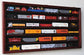 Cherry finish HO scale model train display cabinet by BYMRR Train Store, lockable with 98% UV protection for showcasing trains.