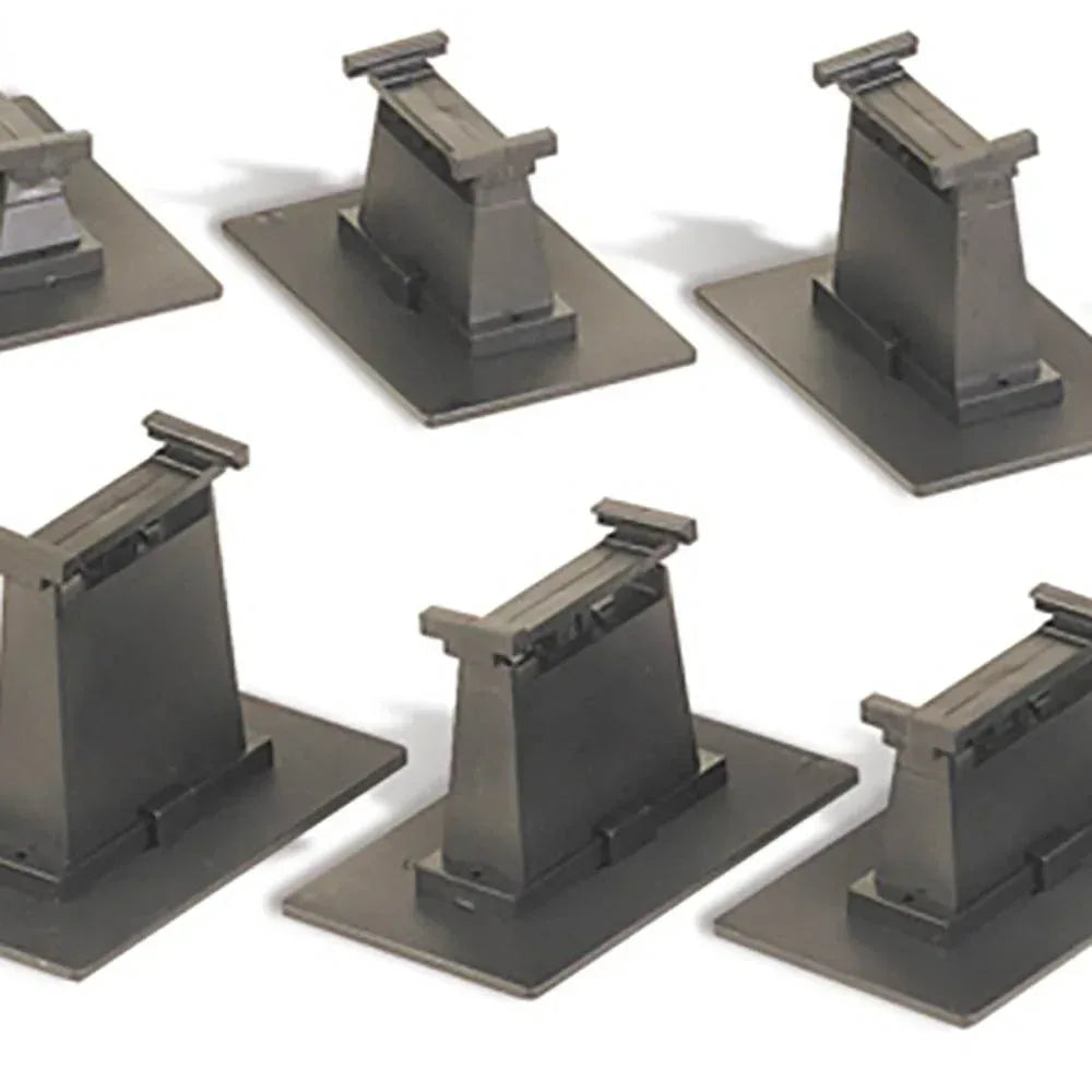 HO scale 14-piece E-Z Track graduated pier set for model railroads, featuring realistic concrete piers and track support structures.