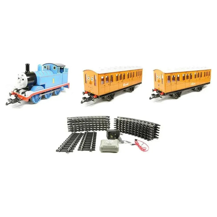 Thomas & Friends HO scale electric train set with Annie and Clarabel carriages, featuring detailed train and scenic track layout.