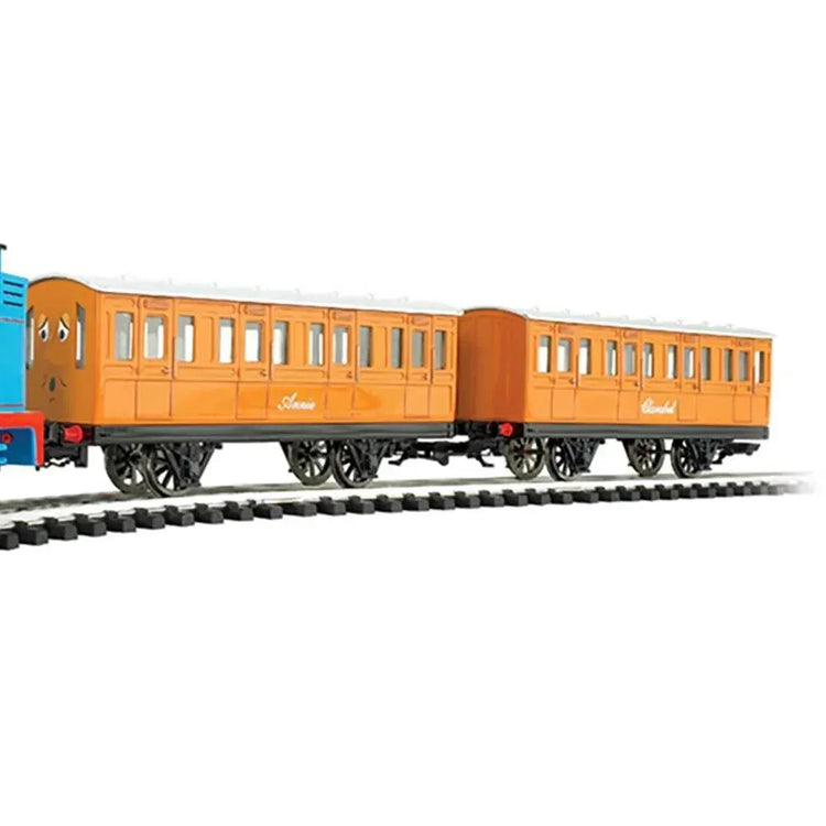Thomas & Friends HO scale electric train set by BYMRR Train Store with Annie and Clarabel carriages on a track scene.