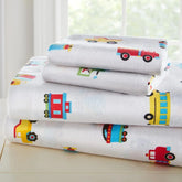 Soft cotton flannel sheet set with trains, planes, and trucks design, cozy and comfortable bedding for children.