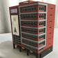 Detailed view of the Outland Models N Scale skyscraper building with shopping center features for model train railway setups.