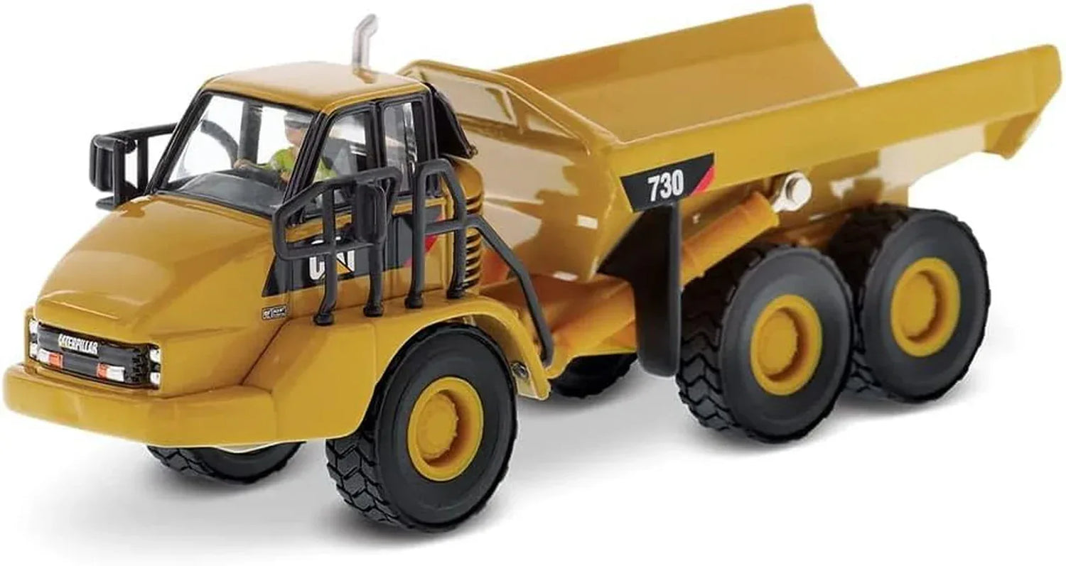 Diecast Masters Caterpillar 730 Articulated Truck HO scale diecast model showing detailed construction vehicle with orange cab and black wheels.