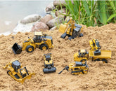 HO scale Caterpillar 730 Articulated Truck diecast model by Diecast Masters, showing detailed construction equipment in gray.
