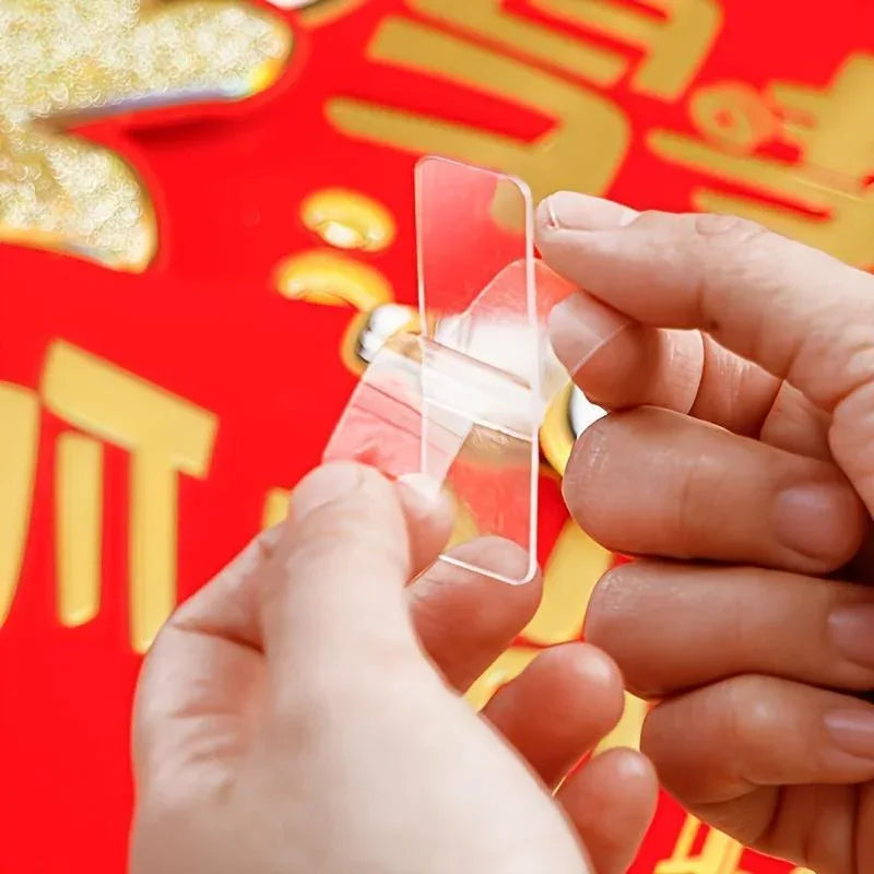 60-piece heavy-duty double-sided adhesive tape set showing rolls of strong, clear double-sided tape on a white background.