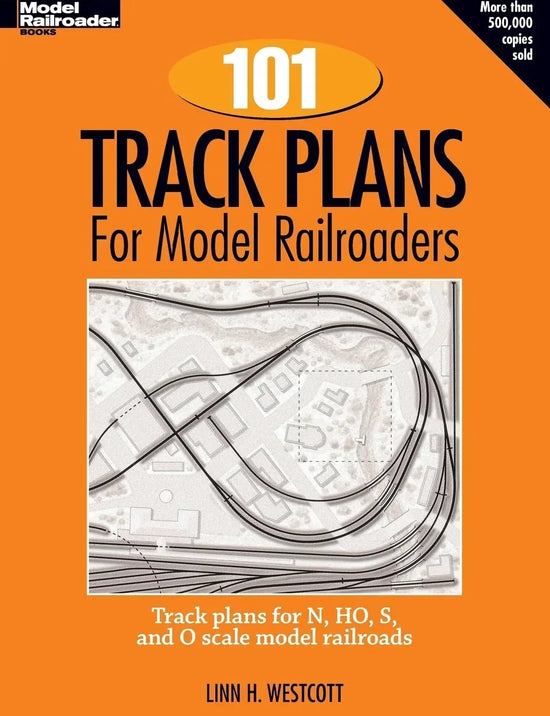 Open book showing detailed model railroad track plans from "101 Comprehensive Track Plans" model railroad handbook, Volume 3.