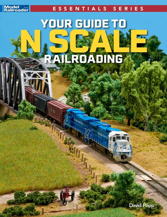 Book cover titled "The Definitive Handbook for N Scale Railroading" with detailed illustrations and text on N scale model trains.