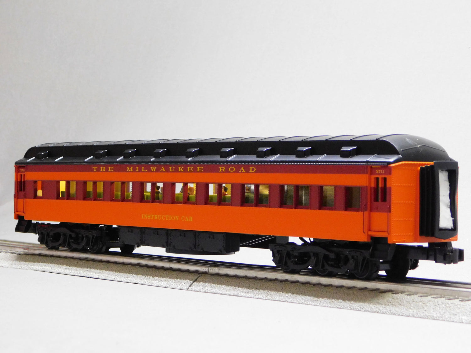 Milwaukee Road training car O gauge model by BYMRR Train Store, featuring detailed train car with Milwaukee Road branding.