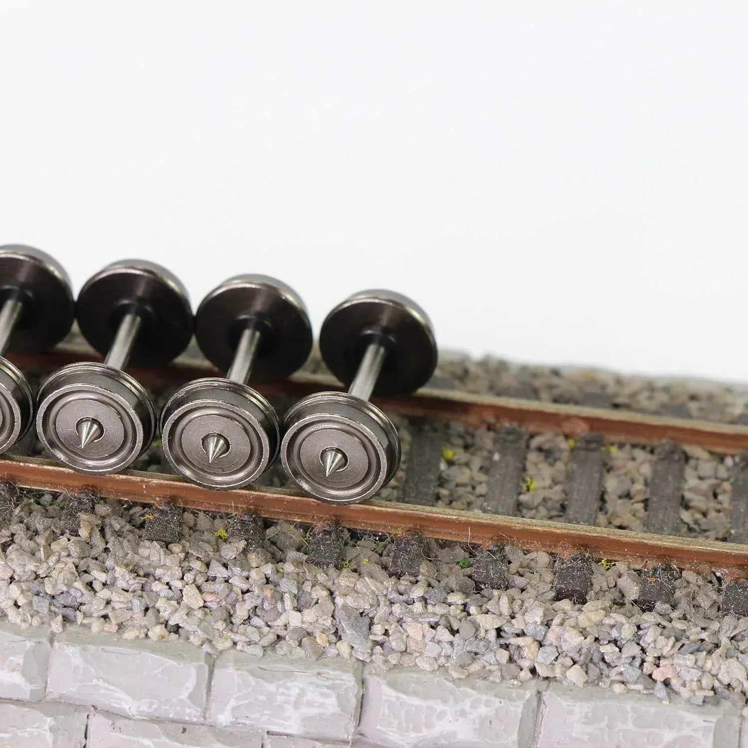 Set of 24 HO scale 1:87 metal model train wheels with 33-inch diameter, compatible with DC model train layouts.