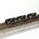 HO scale 1:87 roller bearing trucks with 36-inch metal DC wheels and triple-spring bogies by Evemodel, set of four.