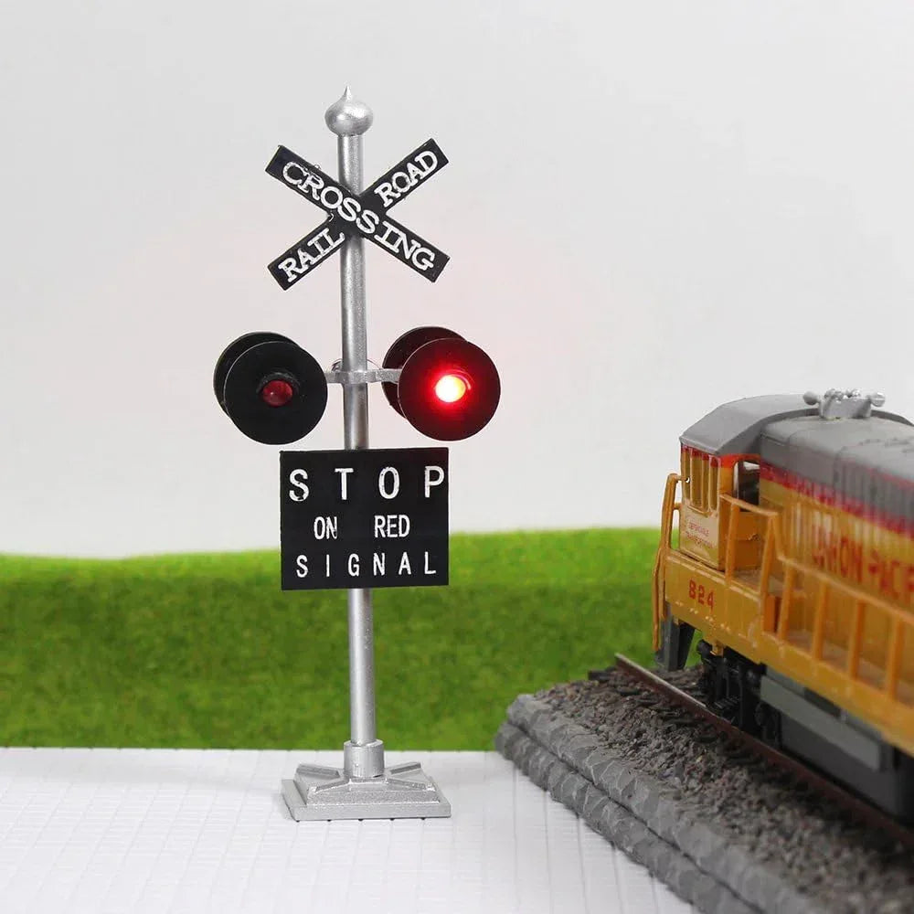 HO scale railroad crossing sign set by Evemodel with four LED flashing red lights and circuit board flasher for model train displays