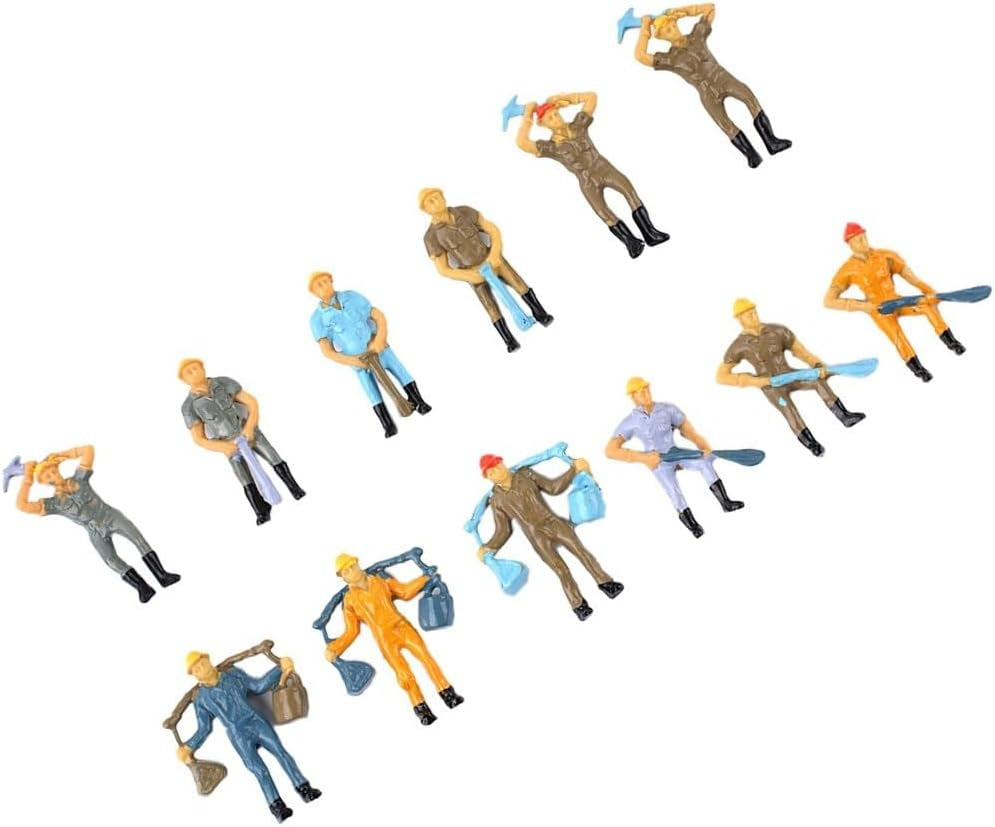 Set of 12 painted O scale 1:48 railway worker figures in various poses for model train layout scenery and station platforms.