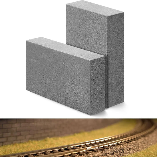 Patelai 2-pack gray abrasive cleaning blocks for HO and N scale model train tracks, 3.2 x 2 x 0.8 inches, shown on tracks.