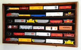 Walnut HO scale model train display cabinet with lockable door and UV protection, designed for safe home train collection display