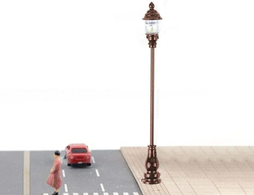 Uonlytech 8-piece miniature garden lighting set with grey decorative lamps for dollhouses, nativity scenes, and model street displays.