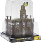 N scale Woodland Scenics pre-assembled firehouse model with detailed brick exterior and fire station doors.