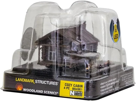 Woodland Scenics Cozy Cabin N Scale Model Kit featuring a detailed miniature wooden cabin for model train layouts.